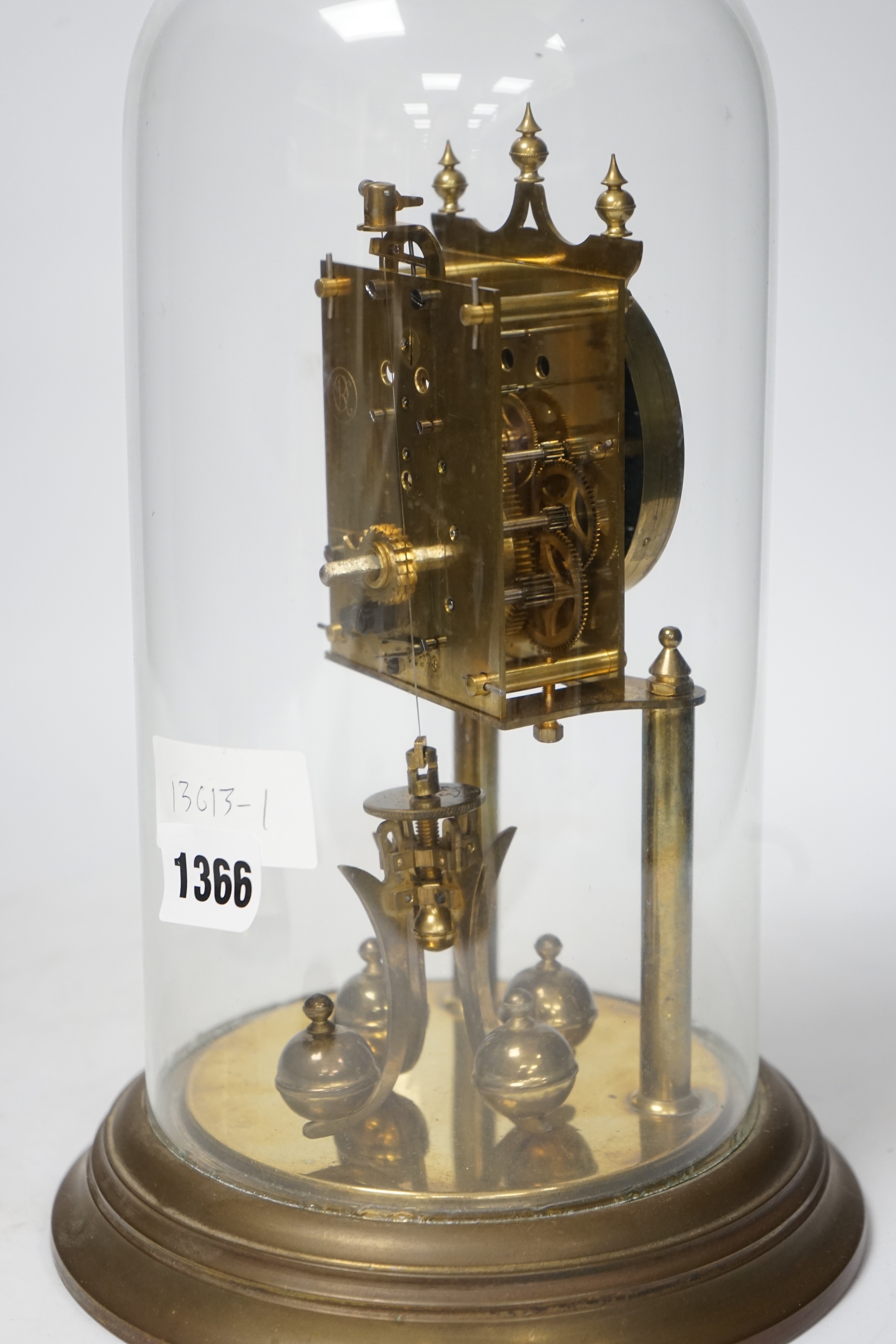 A 20th century German brass torsion pendulum clock under brass dome, 32cm high